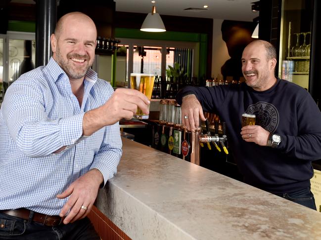 20/5/2020 - Pub owner and Crows great Mark Rucciuto (left) and Simon Hywood, part-owner and general manager at the Alma Hotel in Norwood are happy that the State government have lifted restrictions on hotels ready for trading for the June long weekend. Photo - Naomi Jellicoe