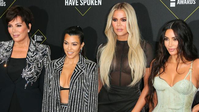 (FILES) In this file photo taken on November 10, 2019 (L-R) Business women/media personality Kris Jenner, Kourtney Kardashian, KhloÃ© Kardashian and Kim Kardashian arrive for the 45th annual E! People's Choice Awards at Barker Hangar in Santa Monica, California. - Fans will have to find another way to keep up with the Kardashians, as the mega-celebrity family announced on September 8, 2020 that their reality show will end next year. "It is with heavy hearts that we've made the difficult decision as a family to say goodbye to Keeping Up with the Kardashians," Kim Kardashian wrote in a post to her 188 million Instagram followers. (Photo by Jean-Baptiste Lacroix / AFP)