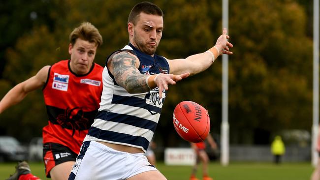 Jason Cooke of Macedon kicks during the round 16 Riddell District Football Netball League 2023 Bendigo Bank Seniors match between Romsey and Macedon at Romsey Park in Romsey, Victoria on August 5, 2023. (Photo by Josh Chadwick)