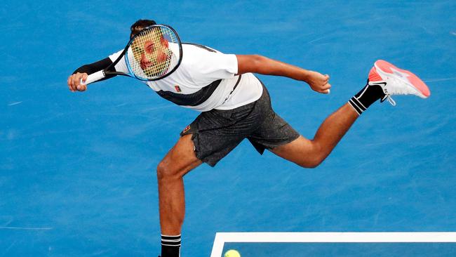 Australia's Nick Kyrgios hits a return against Canada's Milos Raonic during their men's singles match on day two of the Australian Open tennis tournament in Melbourne on January 15, 2019. (Photo by DAVID GRAY / AFP) / -- IMAGE RESTRICTED TO EDITORIAL USE - STRICTLY NO COMMERCIAL USE --