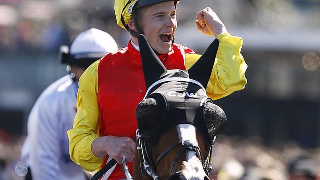 James McDonald celebrates after winning the Darley Classic on Delectation.