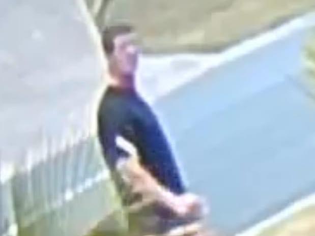 Footage of a stranger entering a yard on the Gold Coast, caught on the security camera of a Pacific Pines resident who had been robbed.