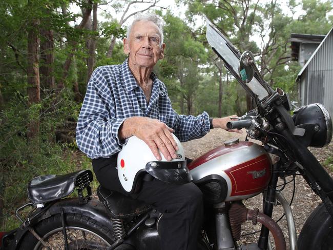 Bruce Reid, 90, poses for a photo with his 1948 BSA YV33 model motorbike, which he bought brand new when he was 19 years old. (AAP Image/David Swift)