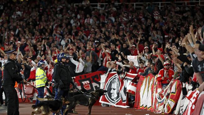 Police inside the stadium keep an eye on Cologne supporters