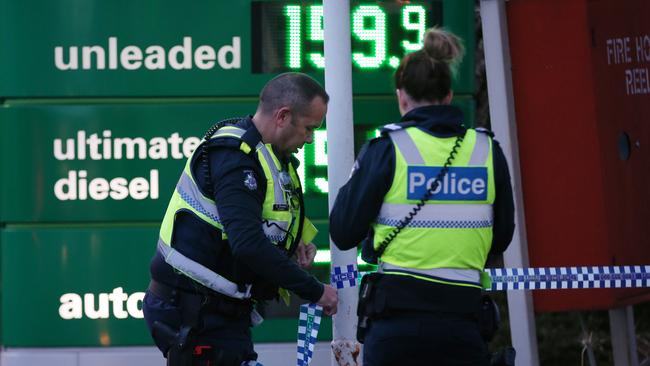 Police tape off the service station. Picture: David Crosling