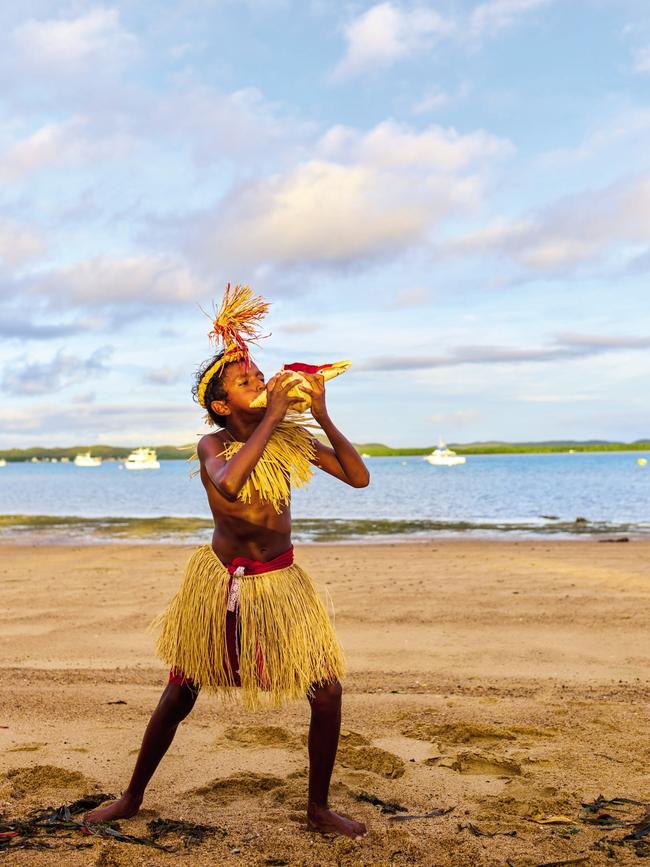 Nathan Seden blows a conch. Picture: Jonathan Cami.