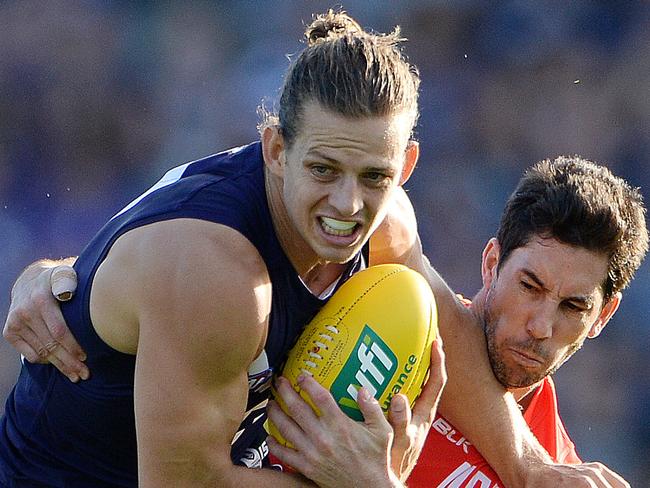 SPORT - AFL Round 2, Fremantle Dockers vs Gold Coast Suns, Subiaco Oval, Perth. Photo by Daniel Wilkins. PICTURED- Fremantle's Nathan Fyfe tries to avoid the tackle from Gold Coast's Michael Rischitelli