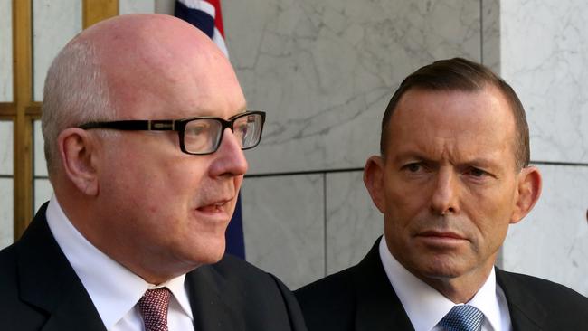 Tony Abbott, right, has hit back at Attorney-General George Brandis, left, warning that legalising same-sex marriage would have vast implications beyond letting gay couples get married.