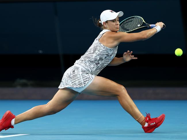 MELBOURNE, AUSTRALIA - JANUARY 23: Ashleigh Barty of Australia plays a backhand in her fourth round singles match against Amanda Anisimova of United States during day seven of the 2022 Australian Open at Melbourne Park on January 23, 2022 in Melbourne, Australia. (Photo by Mark Metcalfe/Getty Images)