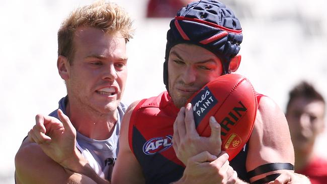 Watts tackles former teammate Angus Brayshaw during an impressive performance for Port Adelaide in Round 1. Picture: Michael Klein.