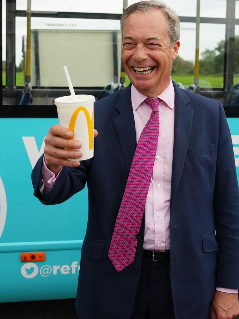 Farage later posed with a milkshake to show he saw the funny side. (Photo by Carl Court/Getty Images)