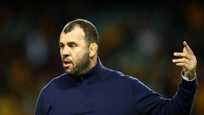 Wallabies coach Michael Cheika watches players warm up at Allianz Stadium.