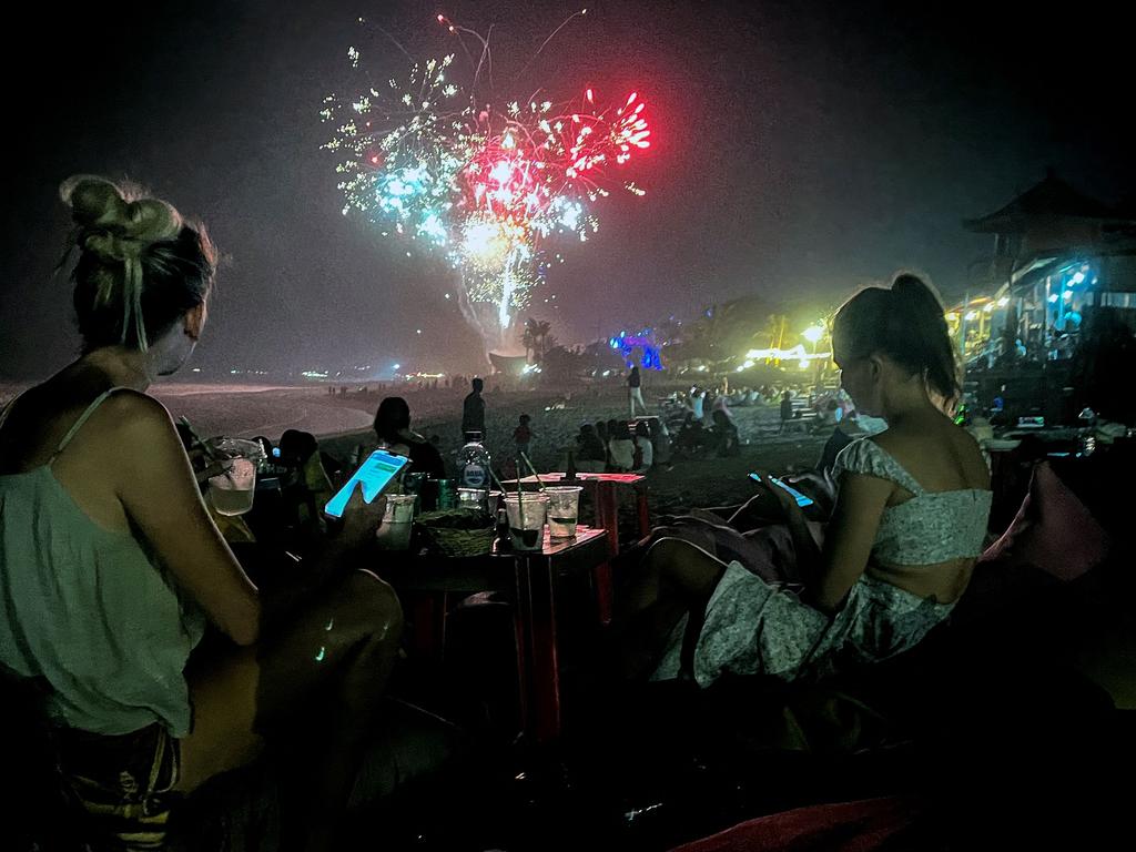 Revellers celebrate New Year's Eve at the beach in the Kerobokan district on Bali. Picture: AFP