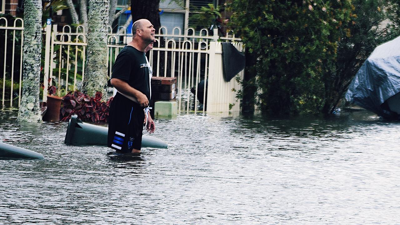 WEST BALLINA: Neighbours call out to each other as West Ballina floodwaters rise on Monday March 30, 2022. Picture: Tessa Flemming.