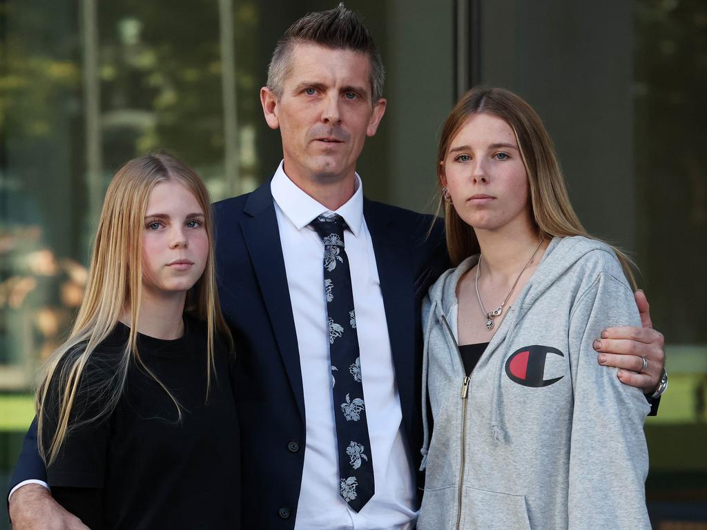 Lee Lovell with daughters Kassie and Scarlett outside Brisbane Supreme Court. Picture: Liam Kidston