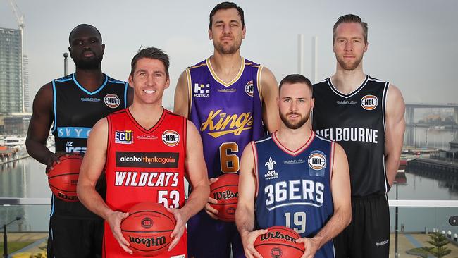 MELBOURNE, AUSTRALIA — JUNE 27: Majok Majok of the New Zealand Breakers; Damian Martin of the Perth Wildcats; Andrew Bogut of the Sydney Kings; David Barlow of Melbourne United and Adam Doyle of the Adelaide 36ers pose during a NBL Media Opportunity on June 27, 2018 in Melbourne, Australia. The National Basketball Association (NBA) and the National Basketball League (NBL) today announced that for the second consecutive year, NBL teams will travel to the U.S. to participate in the NBA preseason. Five NBL teams, including the Adelaide 36ers, Melbourne United, New Zealand Breakers, Perth Wildcats and Sydney Kings, will play a total of seven games against NBA teams in the 2018 NBA preseason, including the Denver Nuggets, LA Clippers, Philadelphia 76ers, Phoenix Suns, Toronto Raptors and Utah Jazz, from Sept. 28 Ã&#144; Oct. 5. (Photo by Scott Barbour/Getty Images)