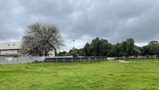 BEFORE: Area around police barracks now fenced off and used by police horses and dogs to be turned into a playground and gardens as part of new Women's and Children's Hospital project. Picture: Supplied by State Government