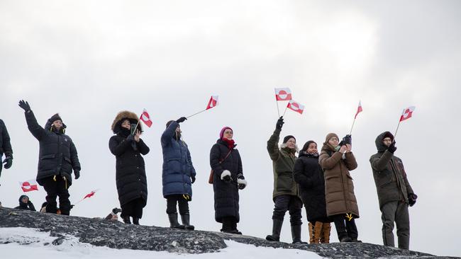 Locals brave the cold to greet the first international flight into the new airport.