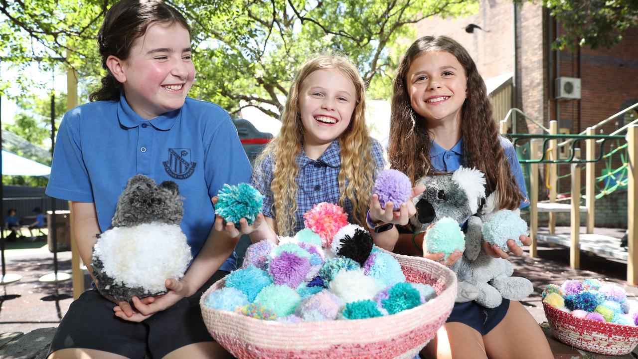 Year 5 students Nina Vujovic, Alyla Browne and Tea McDrury, from Woollahra Public School in NSW, made pompoms for Christmas decorations to raise money for the koalas hurt and injured in the Black Summer bushfires in 2019-2020. Picture: Richard Dobson