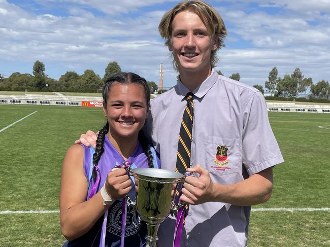 Sacred Heart College's Mekah Morrissy and St Joseph's Lachie Jaques hold the Respect Cup. Picture: Shane Jones.