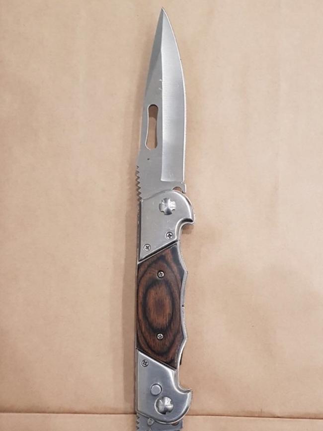 Police found a spring-loaded knife.