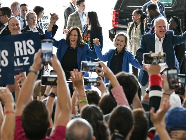 Second Gentleman Doug Emhoff, Kamala Harris, Gwen Walz and Tim Walz wave to supporters upon arrival at Pittsburgh International Airport in Pittsburgh. Picture: AFP