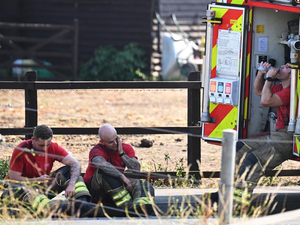 Firefighters rest after battling fires in Wennington, England. Picture: Getty Images