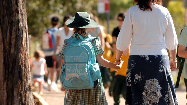 A student walks with her mother.