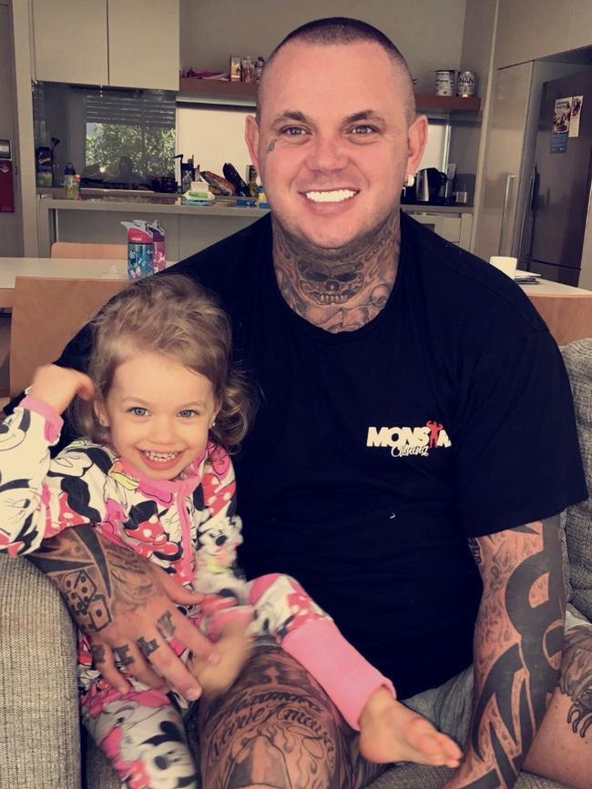 Slain ex-bikie Shane Ross at home with his daughter. Picture: supplied.