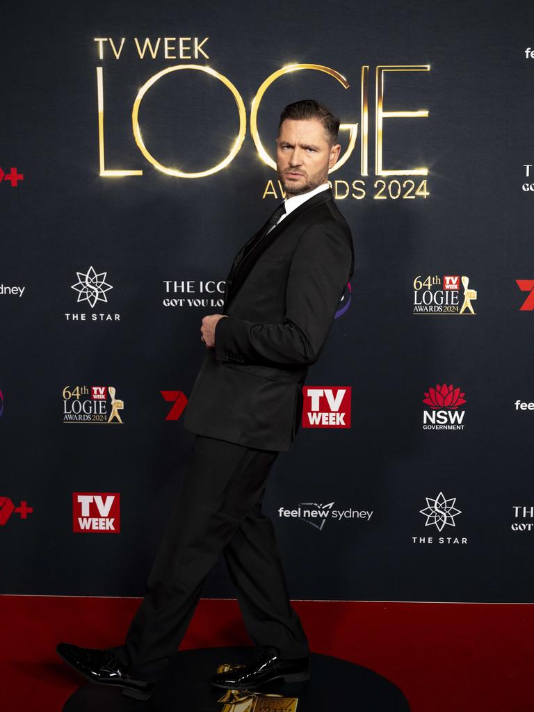 Charlie Pickering makes sures the camera gets his best angle on the red carpet at the TV Week Logie Awards. Picture:NewsWire/ Monique Harmer