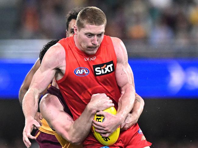 BRISBANE, AUSTRALIA - MAY 04: Matt Rowell of the Suns is pressured by the defence during the round eight AFL match between Brisbane Lions and Gold Coast Suns at The Gabba, on May 04, 2025, in Brisbane, Australia. (Photo by Bradley Kanaris/Getty Images)