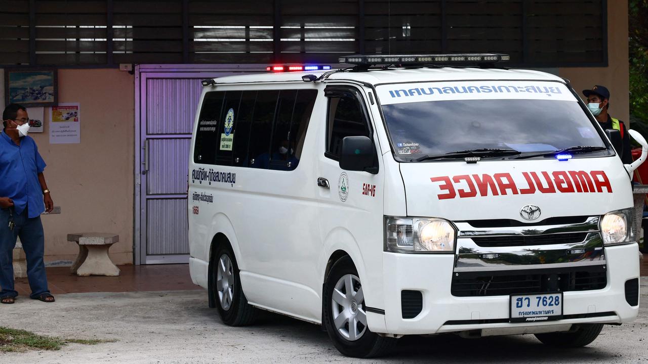 The body of Australian cricket player Shane Warne is transported in an ambulance from the mortuary of the Koh Samui Hospital. Picture: AFP