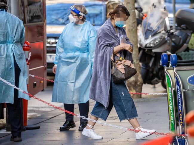 Visitors arrive on a Sky Bus and enter hotel quarantine. Picture: Jason Edwards