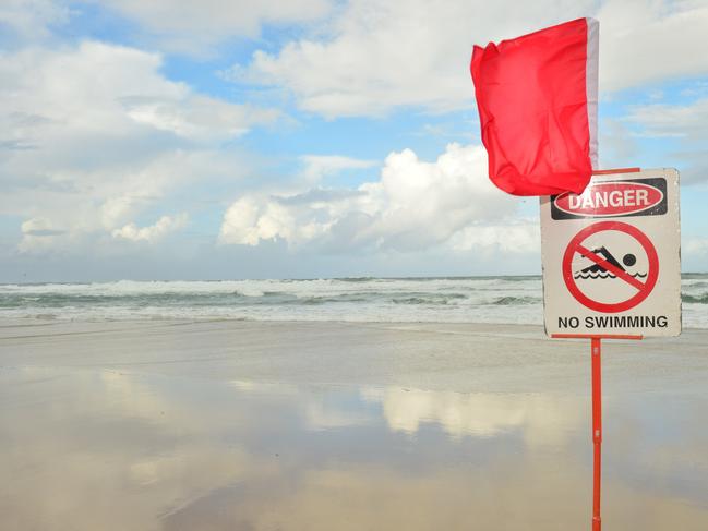 Generic danger. Beach Closed. Swimming danger. Dangerous surf. Red flag. Coolum Beach. No Swimming.