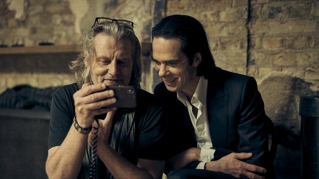 Nick Cave (right) with film director Andrew Dominik while filming in London, March 2021. Picture: Charlie Grey