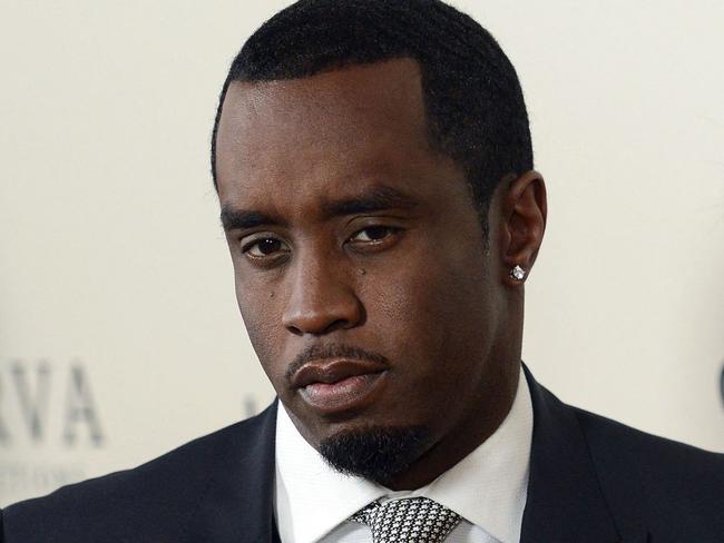 (FILES) Sean P. Diddy Combs with Cassie Ventura attend the premiere of 'The Perfect Match' at the Arclight Theatre in Los Angeles on March 7, 2016. Jury selection is set to begin May 5, 2025, in the blockbuster trial of Combs, the music mogul whose star fell dramatically following his incarceration on charges of sex trafficking and racketeering. Combs, 55, has been awaiting trial since last fall on accusations of leading a crime ring that prosecutors say perpetrated systemic sexual abuse and coerced victims into drug-fueled sex parties using threats and violence. (Photo by Chris Delmas / AFP)