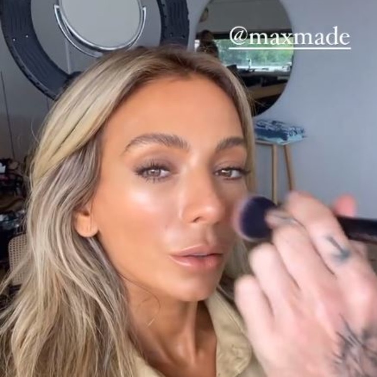 She also showed video of her getting bronzed up for a photo shoot for her fake tan brand. Picture: Nadia Bartel/Instagram.