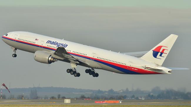 The aircraft that was carrying 239 people when Flight MH370 disappeared, pictured on takeoff three years earlier. File picture