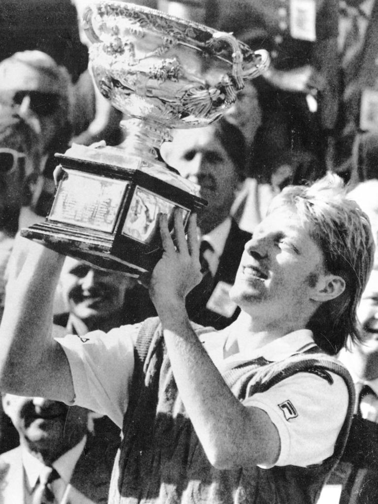 Australian Open tennis tournament men’s singles winner Boris Becker of Germany, holding his trophy aloft after defeating Czech player Ivan Lendl to win his first Australian Open title, 27 Jan 1991.