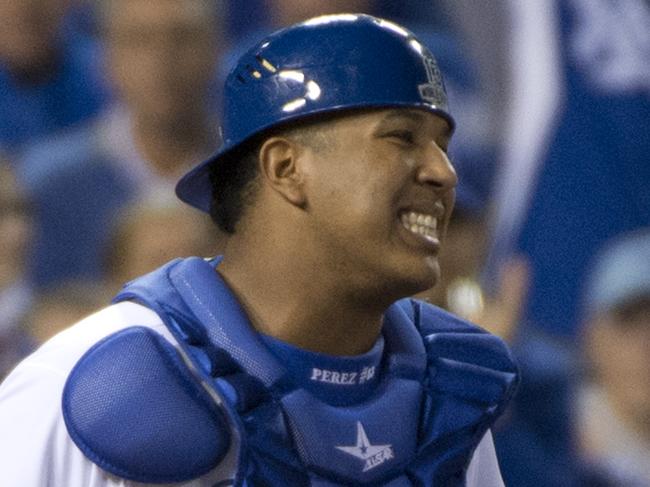 Kansas City Royals catcher Salvador Perez talks with starting pitcher James Shields after the Giants scored their first run in the top of the first inning in Game 1 of baseball's World Series at Kauffman Stadium in Kansas City, Mo., on Tuesday, Oct. 21, 2014. (AP Photo/The Sacramento Bee, Jose Luis Villegas)