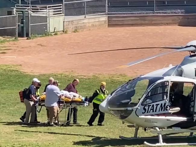 Salman Rushdie being loaded onto a medical evacuation helicopter near the Chautauqua Institution after being stabbed while speaking on stage. Picture: AFP