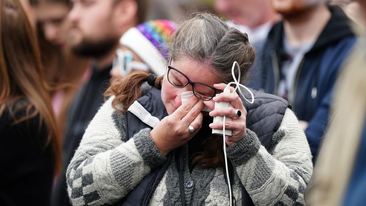 They didn’t need to see the service to become emotional, the atmosphere was enough. Picture: Mike Egerton – WPA Pool/Getty Images