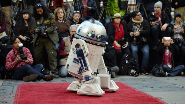 LOS ANGELES, CA - DECEMBER 17: Star Wars character R2-D2 droid brings the wedding rings during the Star Wars-themed wedding of Andrew Porters and Caroline Ritter of Australia in the forecourt of TCL Chinese Theatre IMAX on December 17, 2015 in Hollywood, California. (Photo by Kevork Djansezian/Getty Images)