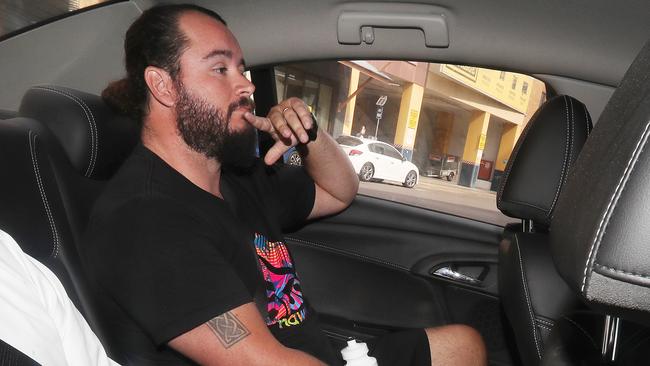 Former Kimberley College principal Paul Thomson's son-in-law Kevin Ferguson being driven into the Brisbane watch house by police. Photographer: Liam Kidston.