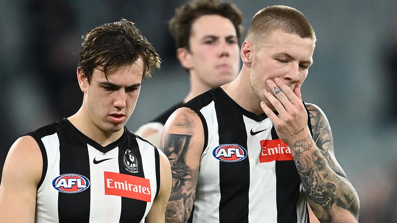 MELBOURNE, AUSTRALIA - MAY 23: Callum L. Brown, Jordan De Goey, Steele Sidebottom and Josh Thomas of the Magpies look dejected after losing the round 10 AFL match between the Collingwood Magpies and the Port Adelaide Power at Melbourne Cricket Ground on May 23, 2021 in Melbourne, Australia. (Photo by Quinn Rooney/Getty Images)