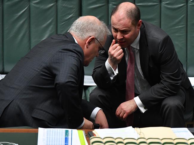 Scott Morrison and Josh Frydenberg get down to business during Question Time yesterday. Picture: Getty Images