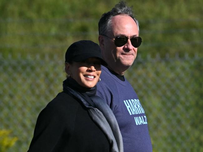 US Vice President and Democratic presidential candidate Kamala Harris (L) walks with husband Doug Emhoff at the Pennsylvania Air National Guard Base on the eve of the presidential debate. Picture: AFP