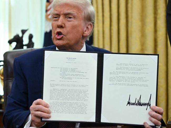 US President Donald Trump shows the executive order on reciprocal tariffs. Picture: AFP