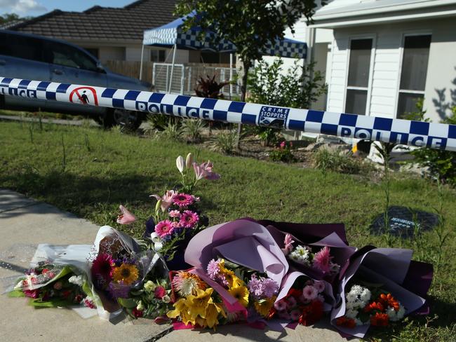 Flowers outside the Pimpama home where Mrs Bradford was killed. Picture by Scott Fletcher