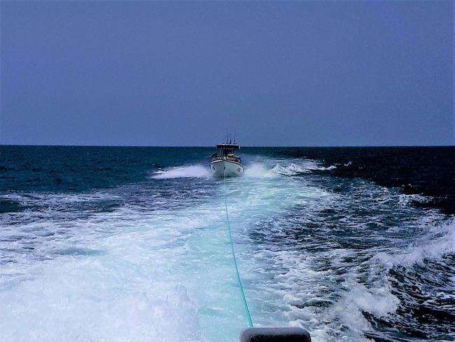 On Sunday about 11.45am, Yeppoon Rescue 1 was diverted from a training exercise to assist a five metre centre console fishing vessel with three people on board which had engine trouble in the area of Findlay's Reef.